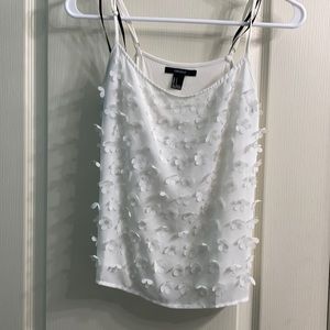 Flowy white tank with flower detail